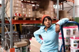 A warehouse worker working with heavy duty racks.