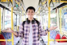A young man in a bus.