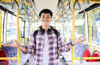 A young man in a bus.